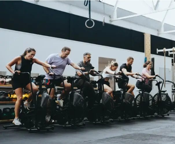 Members working out on bikes